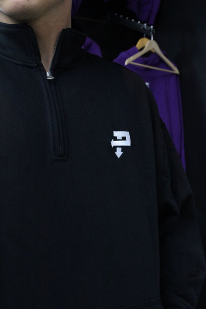 Embroidered TP chest logo on black quarter-zip
